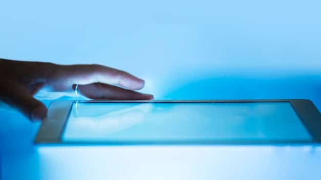 A close-up image of a hand hovering over a digital tablet displaying a privacy policy agreement, highlighting the importance of user consent and transparency in data handling.