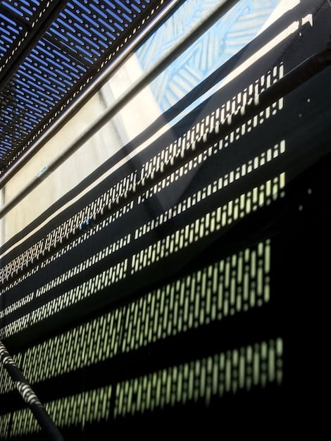 A close-up of a computer screen displaying lines of code intertwined with scales of justice, symbolizing the need for fairness and ethical considerations in AI algorithms.